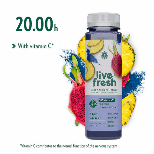 LiveFresh “Keep Cool” juice with pineapple, spirulina, pitaya, and lemon, against a background of sliced pineapple, pink dragon fruit, and spirulina powder. The recommended time to drink the juice during the juice cleanse is 8 p.m.  There is also a note stating “with vitamin C” to support the nervous system.